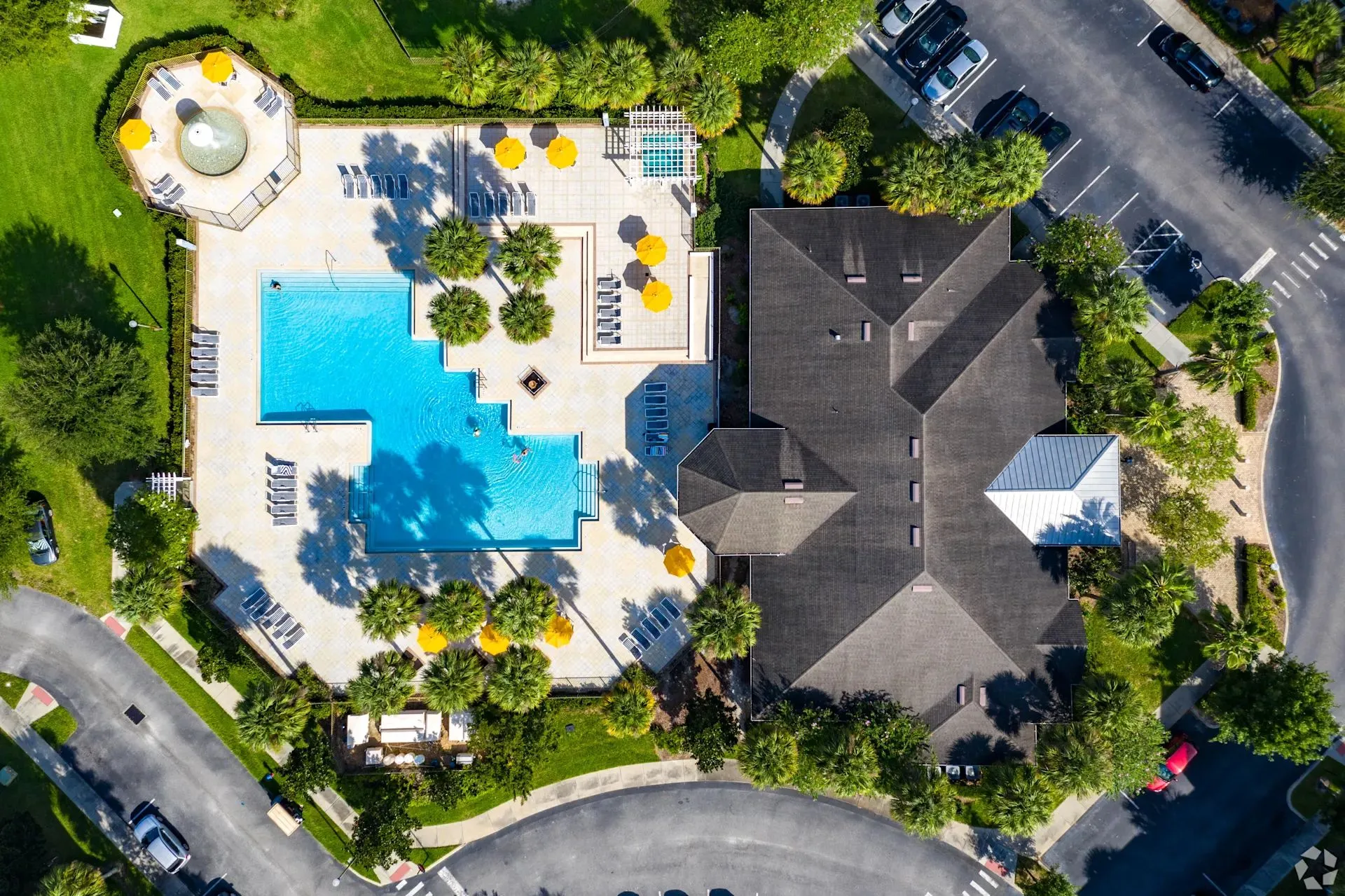 Aerial view of The Glen at Cagan Crossings resort-style pool and palm-lined deck
