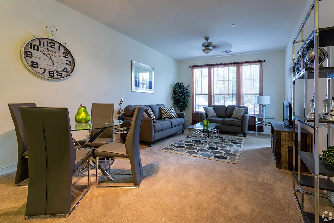 Apartment living room at The Glen at Cagan Crossings